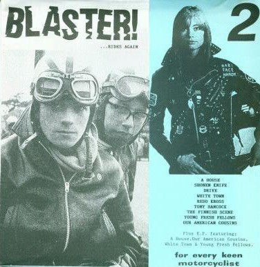 Cover of Blaster! ...Rides Again 7-inch. It is split across the middle vertically into two halves. The left half, a black and white photo of two young motorcyclists, the name of the fanzine. The right half has a light blue background. In the top right corner, a big number 2. Right next to it a waist-up photo of a motorcyclist posing. Below the image, some flavor text mentioning several bands: A House, Shonen Knife, Drive, White Town, Redd Kross, Tony Hancock, The Finnish Scene, Young Fresh Fellows, and Our American Cousins. More text below it says 'Plus E.P. featuring: A House, Our American Cousins, White Town & Young Fresh Fellows'. Below it, one last bit of flavor text: 'For every keen motorcyclist.'