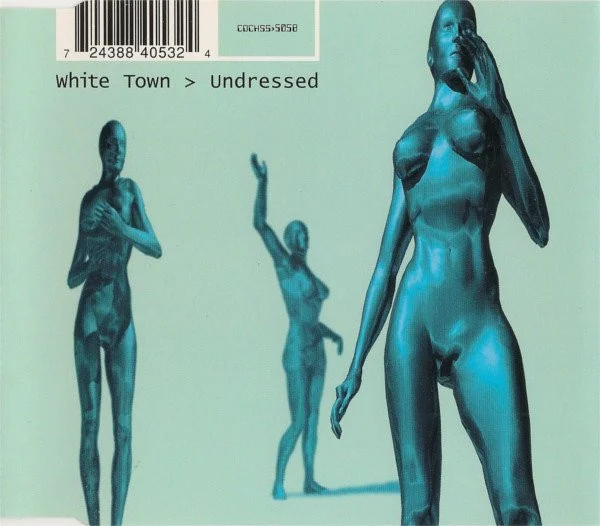 Cover of Undressed CD2. Blue background. Three poorly rendered 3D metallic naked women are positioned posing throughout the main frame of the cover. On the top left corner, the barcode and the catalogue number. Below that, the text 'White Town > Undressed'.