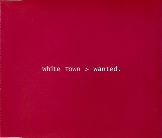 Cover of Wanted. Scarlet background. White text in a monospace font in the middle, 'White Town > Wanted.'.